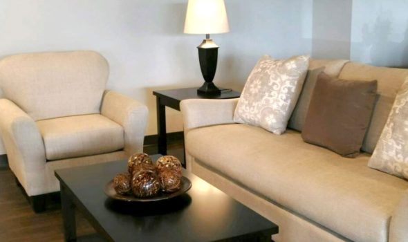 living room setting with, chair, couch, end table, and coffee table