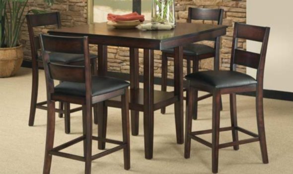 dining room table with flower vase in center and surrounded by four chairs