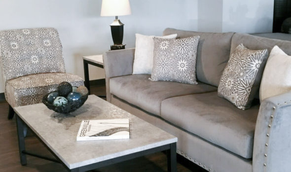 living room setting with couch, end table, and coffee table